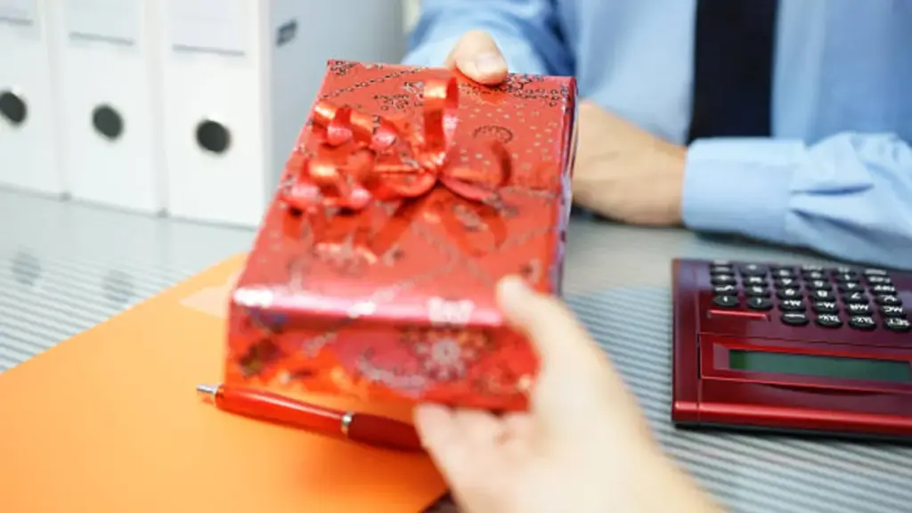 businessman is giving corporate gift box to other