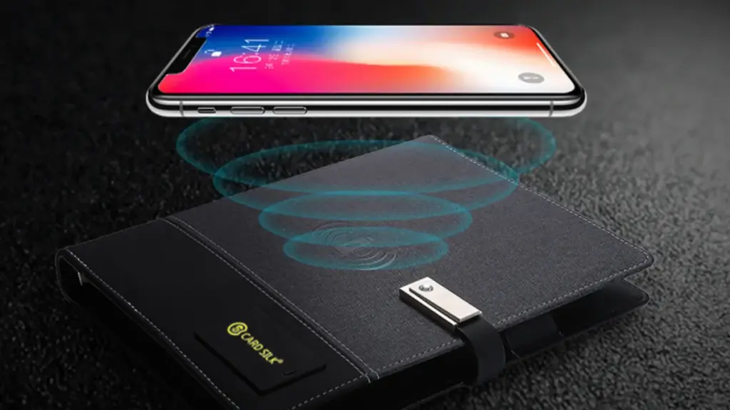 iphone on the wireless charger notebook