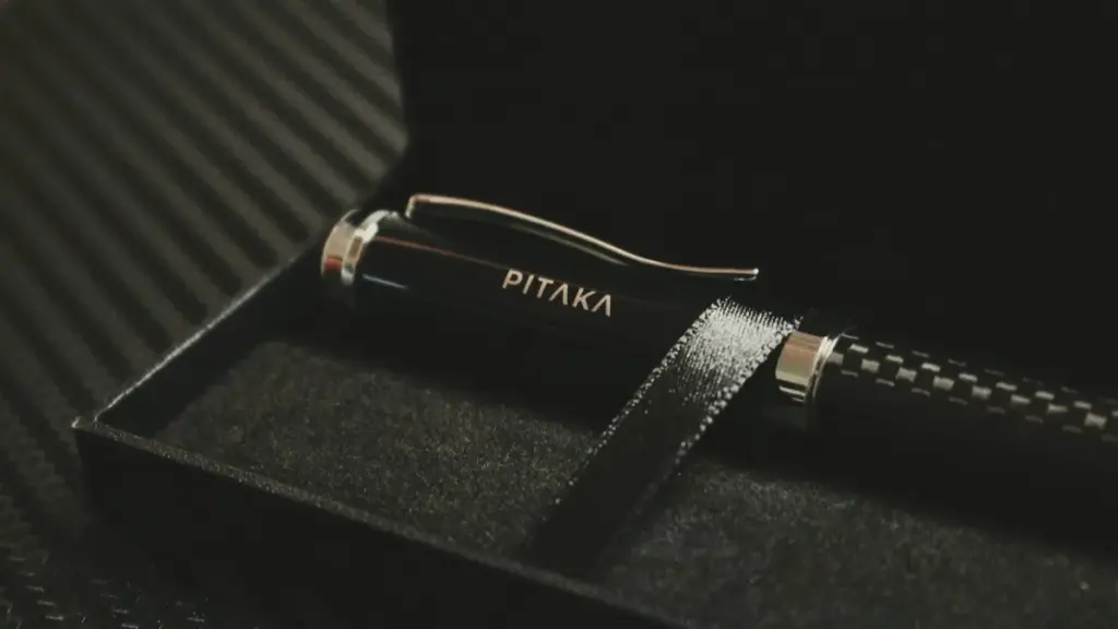 a metal fountain pen in pen box