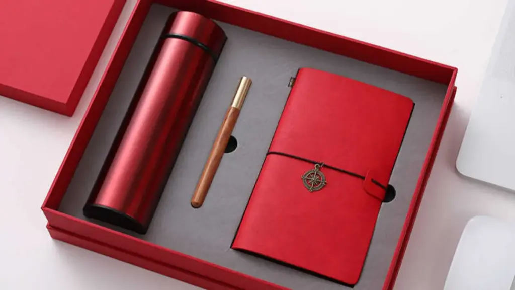 red notebook and pen set