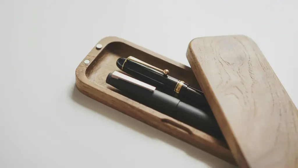 two metal fountain pen in a wooden pen box