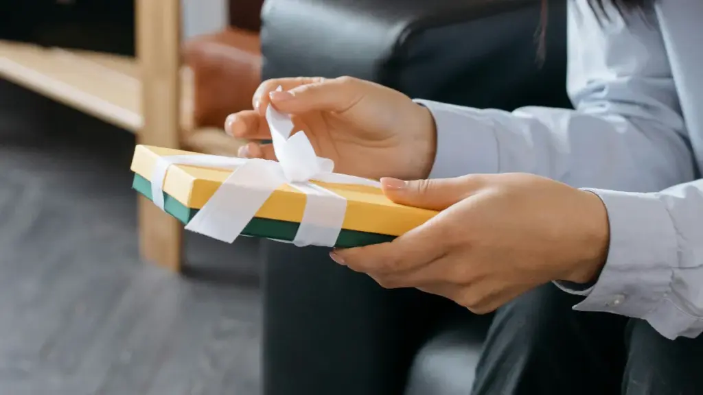 a woman holding corporate gift set
