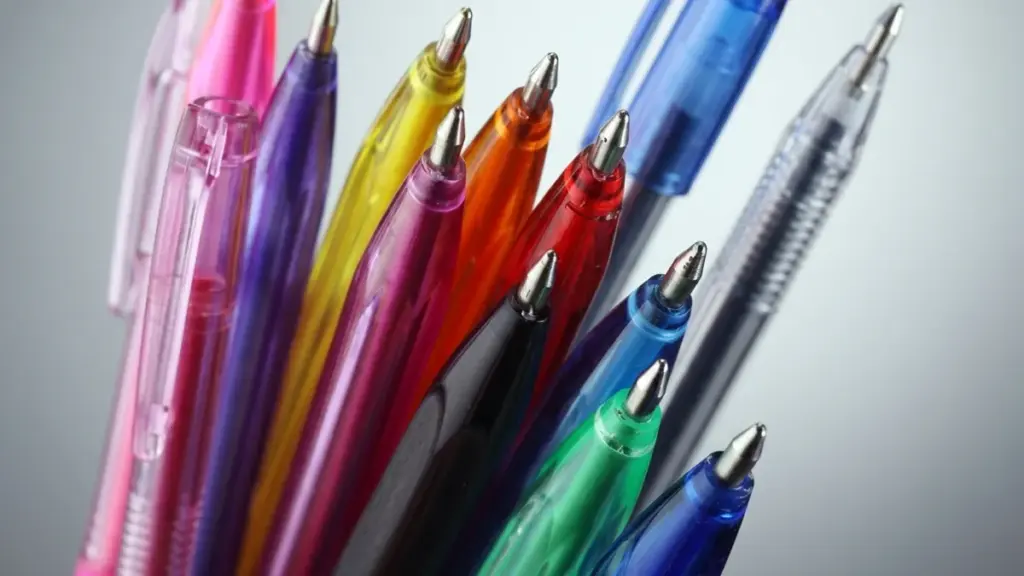 Close-up of vibrant, colorful translucent ballpoint pens with metallic tips