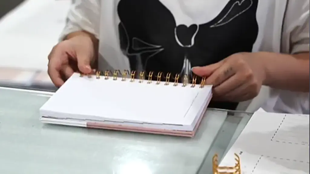 The inner pages of a loose-leaf book are bound