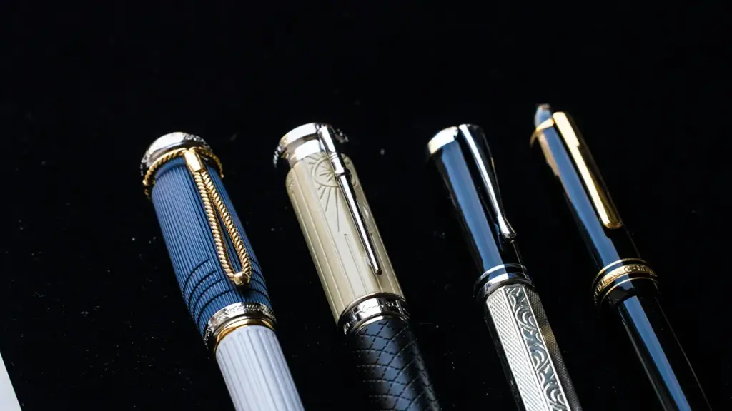four luxury fountain pens in the pen box
