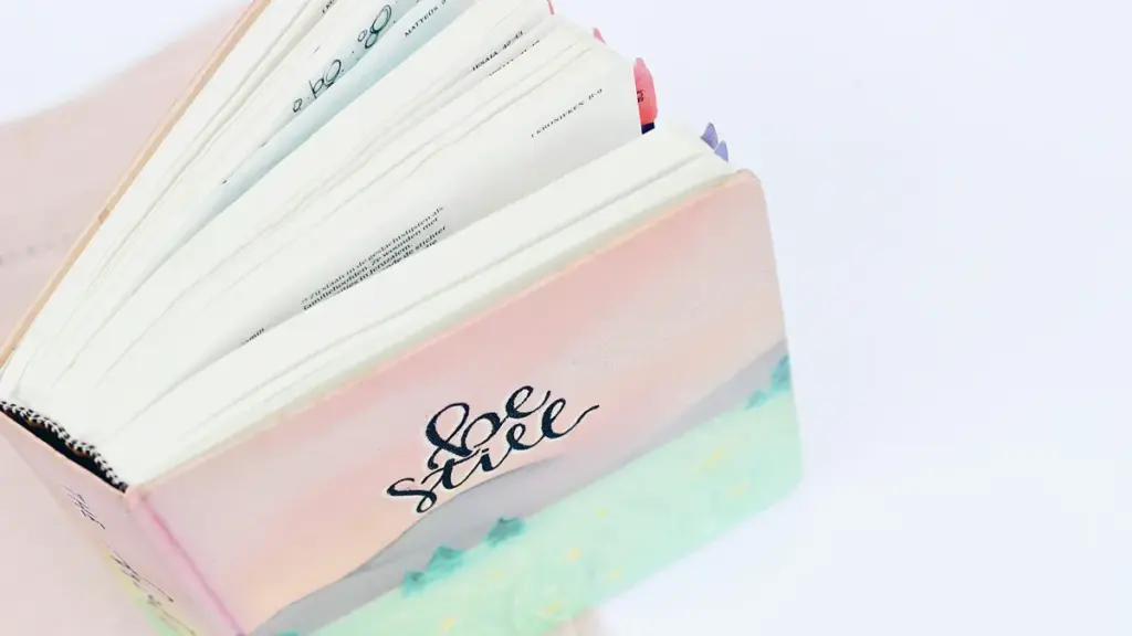 Top view of an open thick journal with decorative tabs
