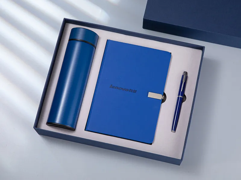 Blue Lenovo corporate gift box containing insulated thermos bottle, branded notebook and matching ballpoint pen